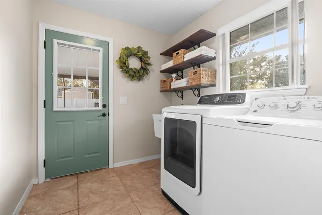 a utility room with dryer and washer