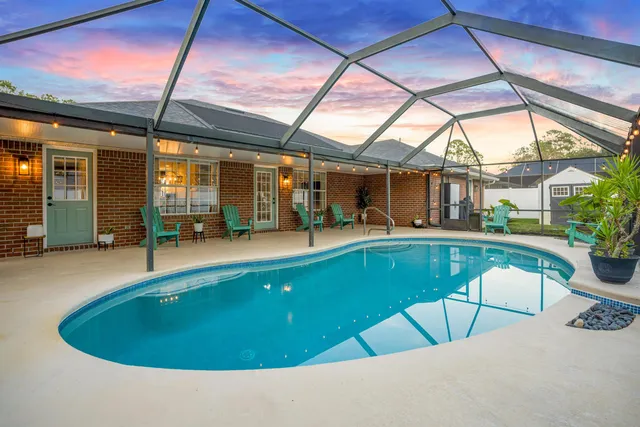 a view of swimming pool with seating space