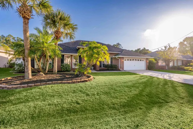 a view of a house with a yard porch and sitting area