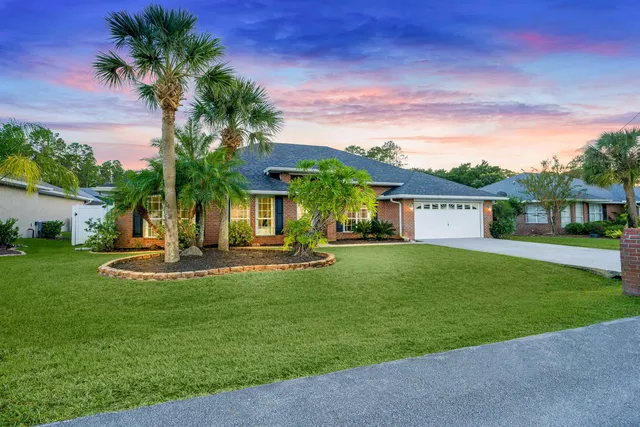 a view of house with outdoor space and swimming pool