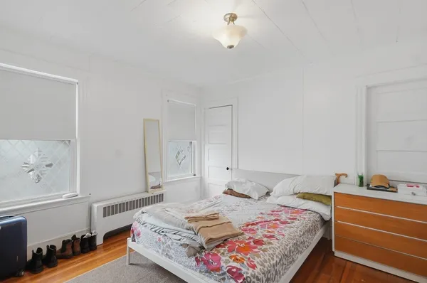 a bedroom with a bed and lamp