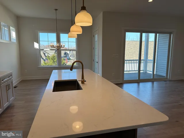 a kitchen with a sink and a stove