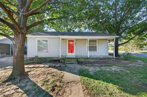 an empty room with window ceiling fan and windows