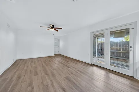 a view of a living room and chandelier fan kitchen view