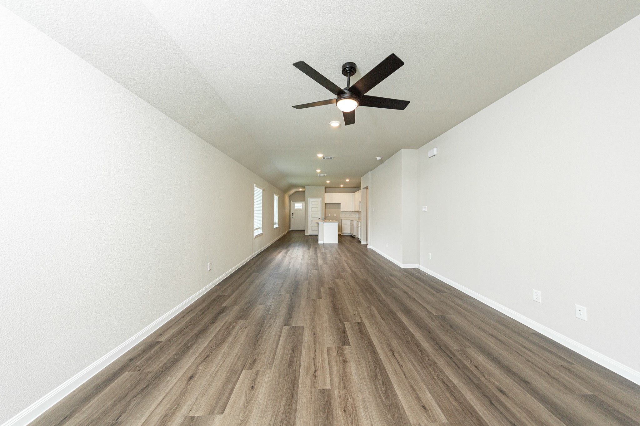 13654 Kit Run Splendora, TX 77372 - Photo 6 of 24 a view of a big room with wooden floor and staircase