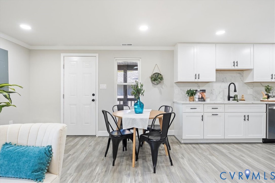 1701 Arlington Road Hopewell, VA 23860 - Photo 16 of 29 a view of kitchen with cabinets table and chairs