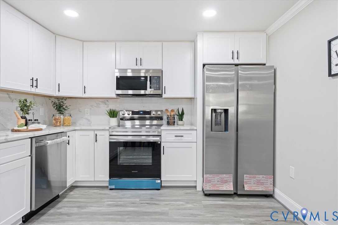 1701 Arlington Road Hopewell, VA 23860 - Photo 20 of 29 a kitchen with cabinets stainless steel appliances and a counter space