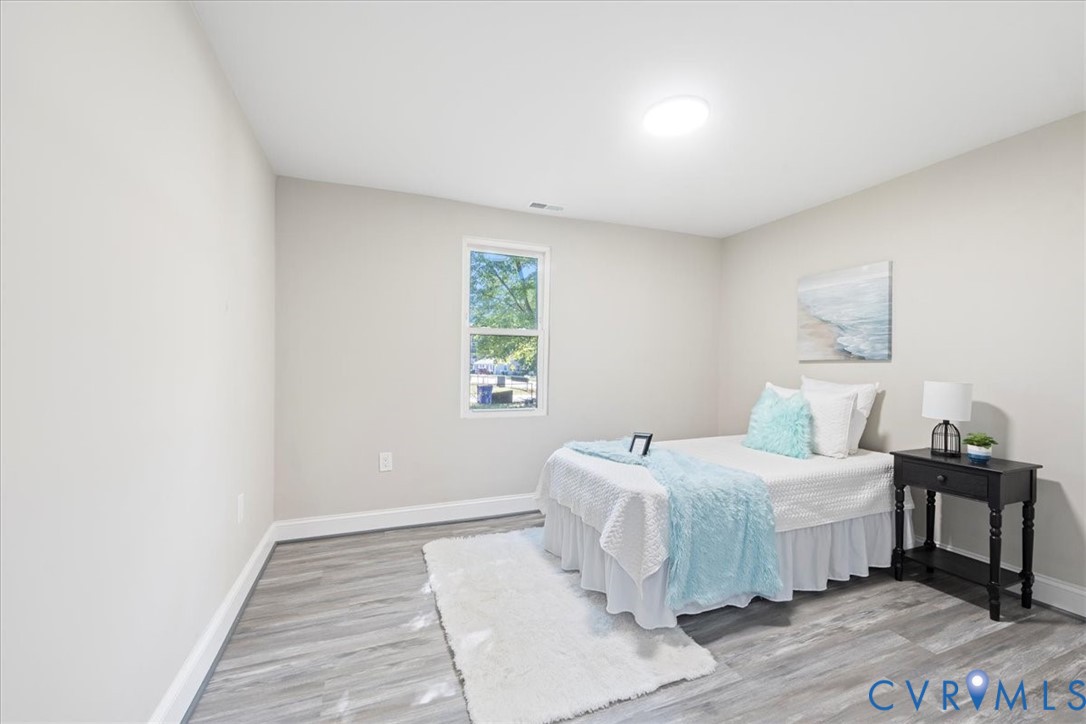 1701 Arlington Road Hopewell, VA 23860 - Photo 23 of 29 a bedroom with a bed and a window