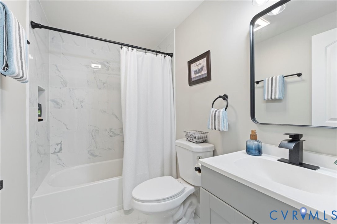 1701 Arlington Road Hopewell, VA 23860 - Photo 25 of 29 a bathroom with a sink toilet and shower