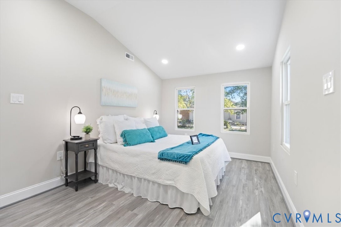 1701 Arlington Road Hopewell, VA 23860 - Photo 28 of 29 a bedroom with a bed and wooden floor