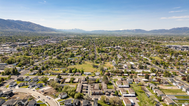 283 West 600 North, Unit 2 Logan, UT 84321 - Photo 36 of 36 Expansive aerial perspective showcasing a residential district with a backdrop of distant mountains