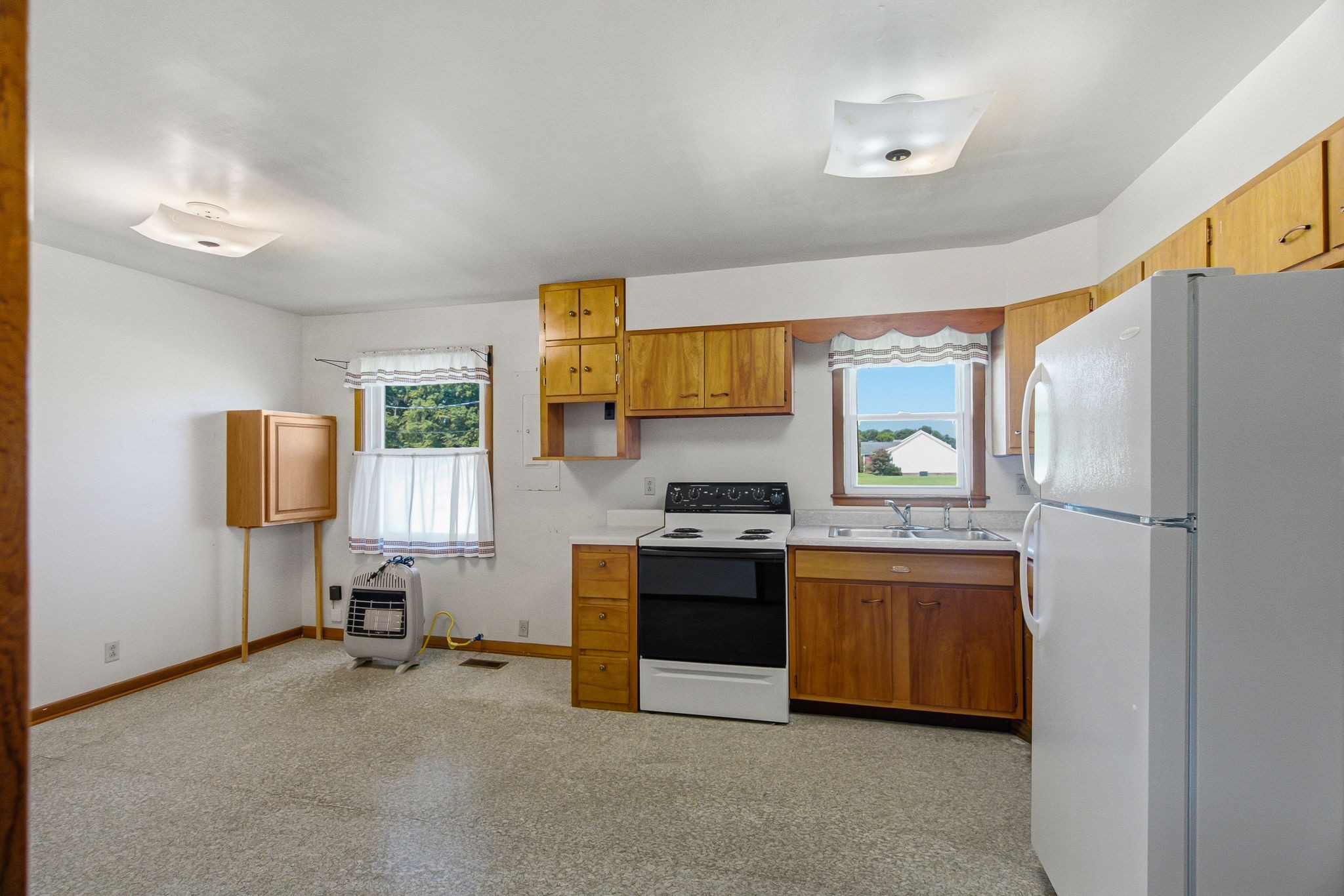 5204 Highway 161 Springfield, TN 37172 - Photo 15 of 40 a kitchen with stainless steel appliances granite countertop a stove and a refrigerator