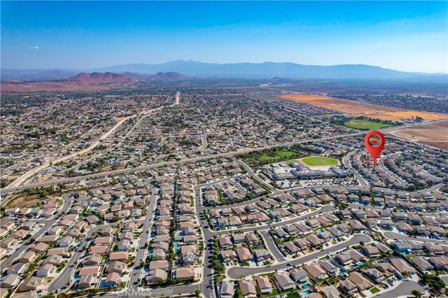 an aerial view of residential houses with outdoor space