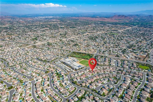 an aerial view of residential house with an outdoor space
