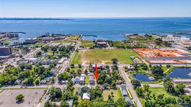 an aerial view of residential houses with outdoor space