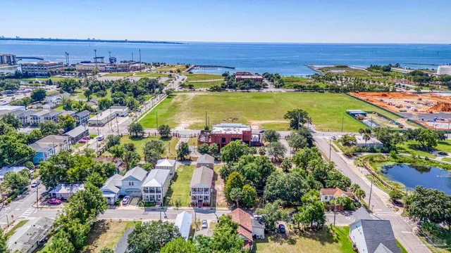an aerial view of a city and lake view