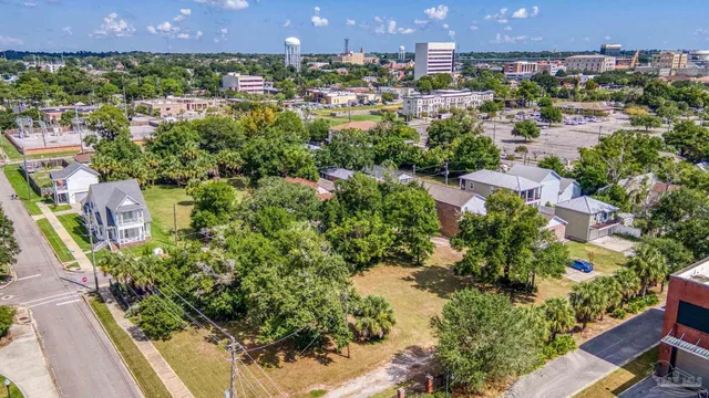 a view of a yard with a house and trees