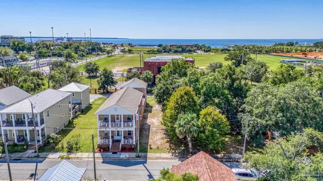 an aerial view of a house with a lake view