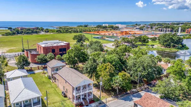 a view of a city with an ocean view