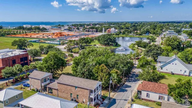 an aerial view of a houses with a yard