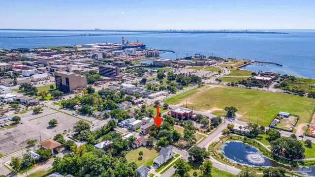 an aerial view of a houses with a lake view