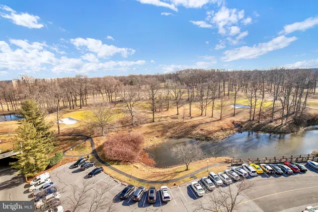 a view of a swimming pool with a lake view