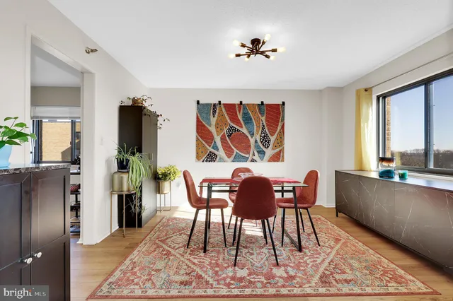 a view of a dining room with furniture window and wooden floor