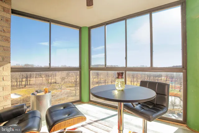 a living room with a table and chair