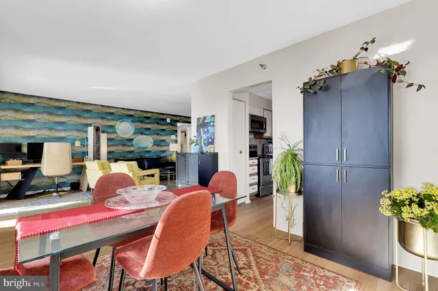 a dining room with furniture and chandelier
