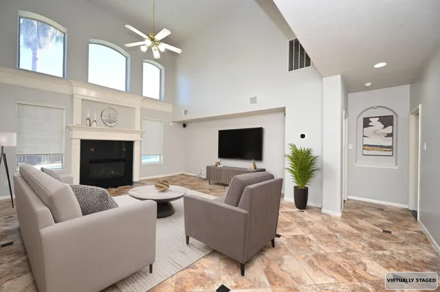 a view of an empty room with a fireplace