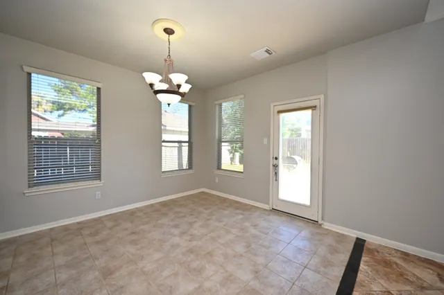 a view of a kitchen with a sink stainless steel appliances and cabinets
