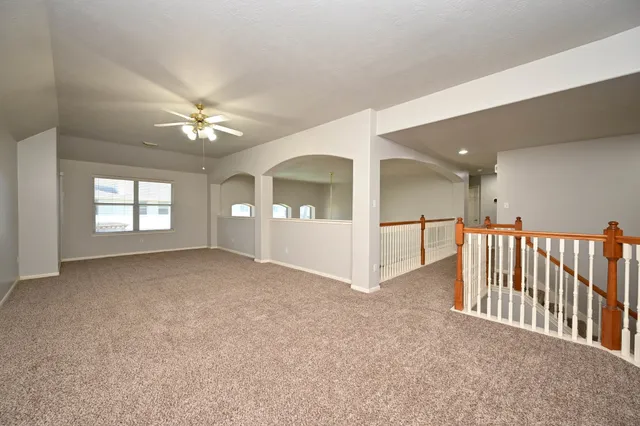 a view of empty room with a fireplace