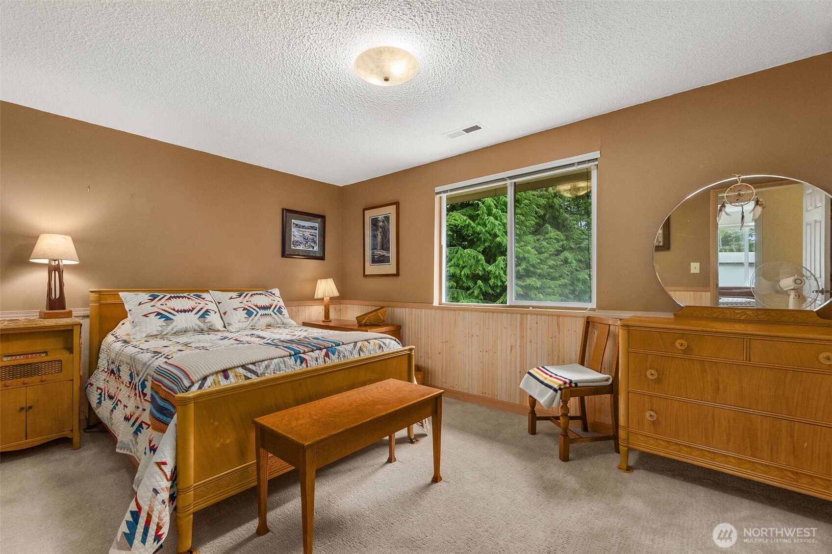 711 Purkey Avenue Aberdeen, WA 98520 - Photo 25 of 39 a bedroom with a bed and a dresser next to a window