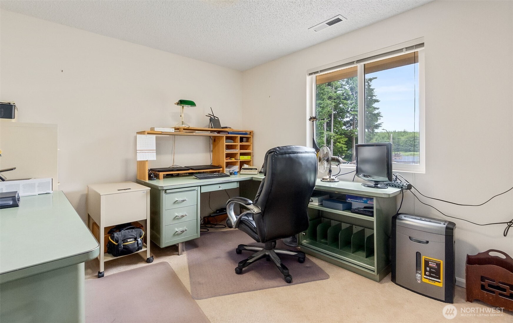 711 Purkey Avenue Aberdeen, WA 98520 - Photo 30 of 39 a view of a workspace with furniture and a window