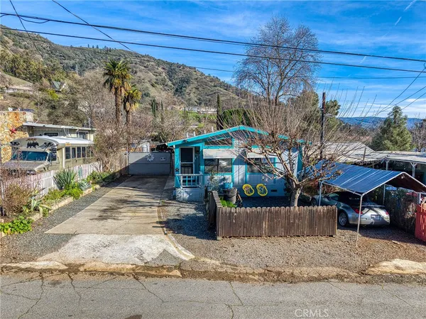 a view of a house with a bench in patio