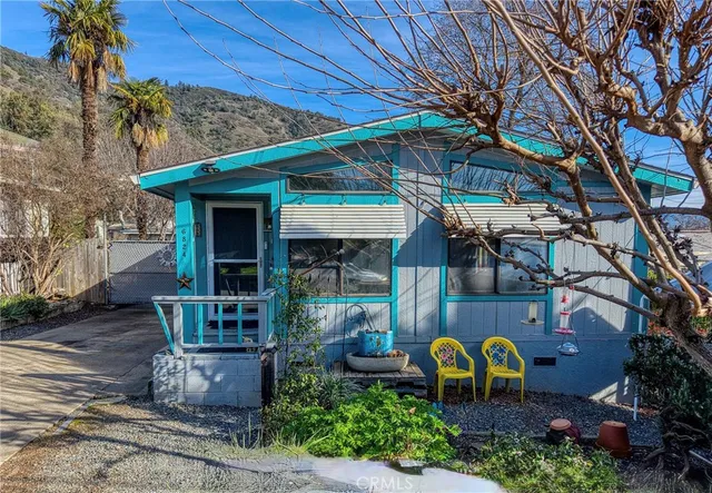 a view of a chairs and table in the patio