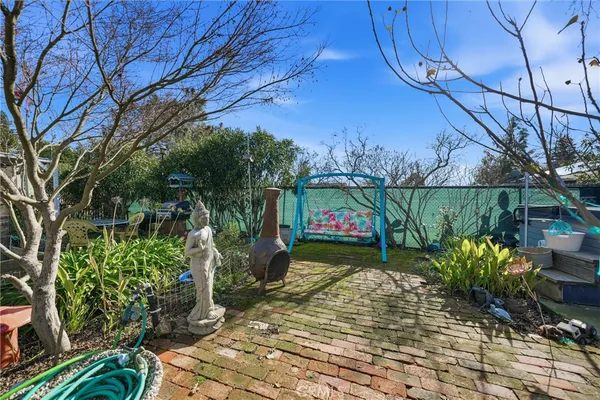 a front view of a house with outdoor seating