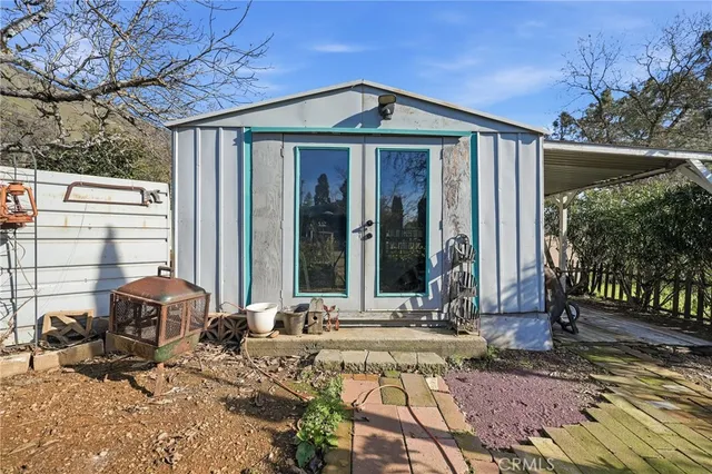 a view of a backyard with sitting area