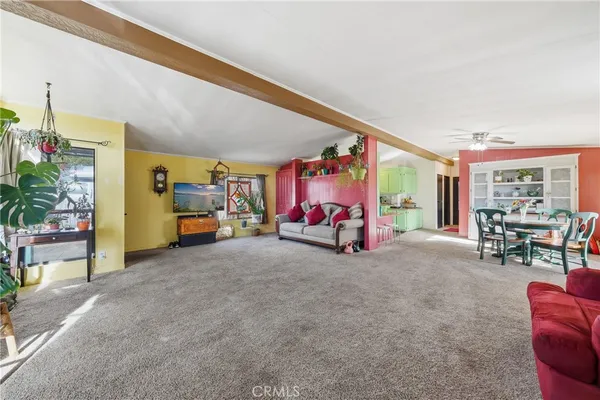 a living room with furniture and large window