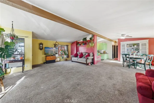 a living room with furniture and large window
