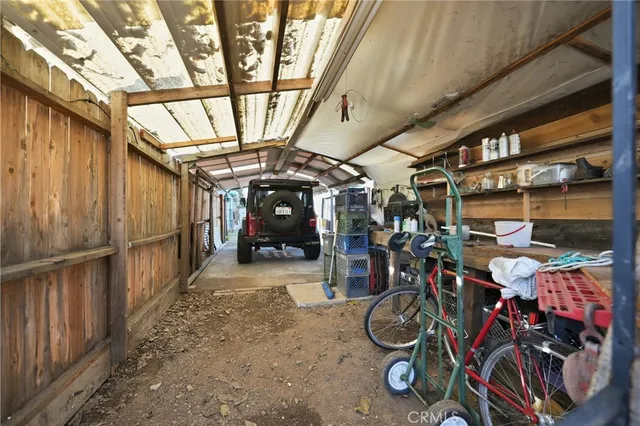 a view of a backyard with a tree
