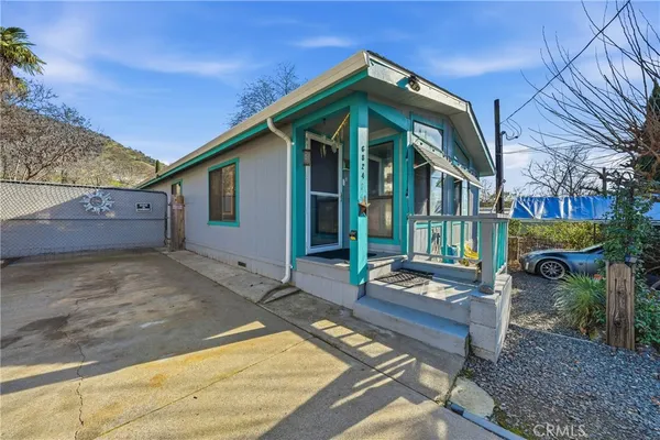 a view of a chairs and table in the patio
