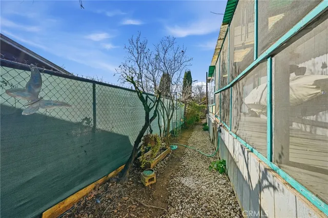 an outdoor space with lots of plants and vegetables