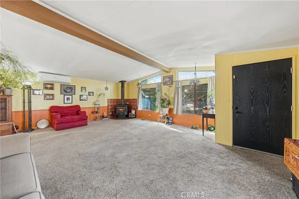 a bedroom with furniture and a lamp