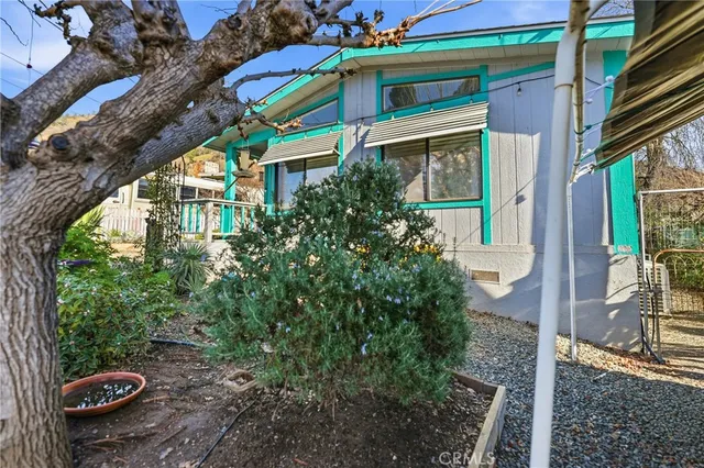 a view of a chairs and table on the patio