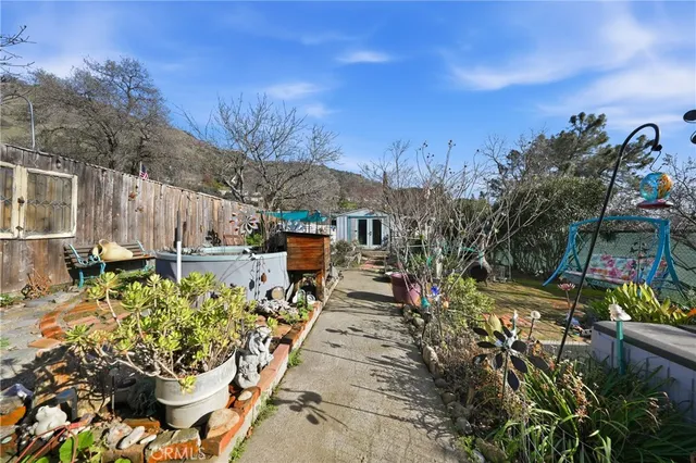 a view of a backyard with sitting area
