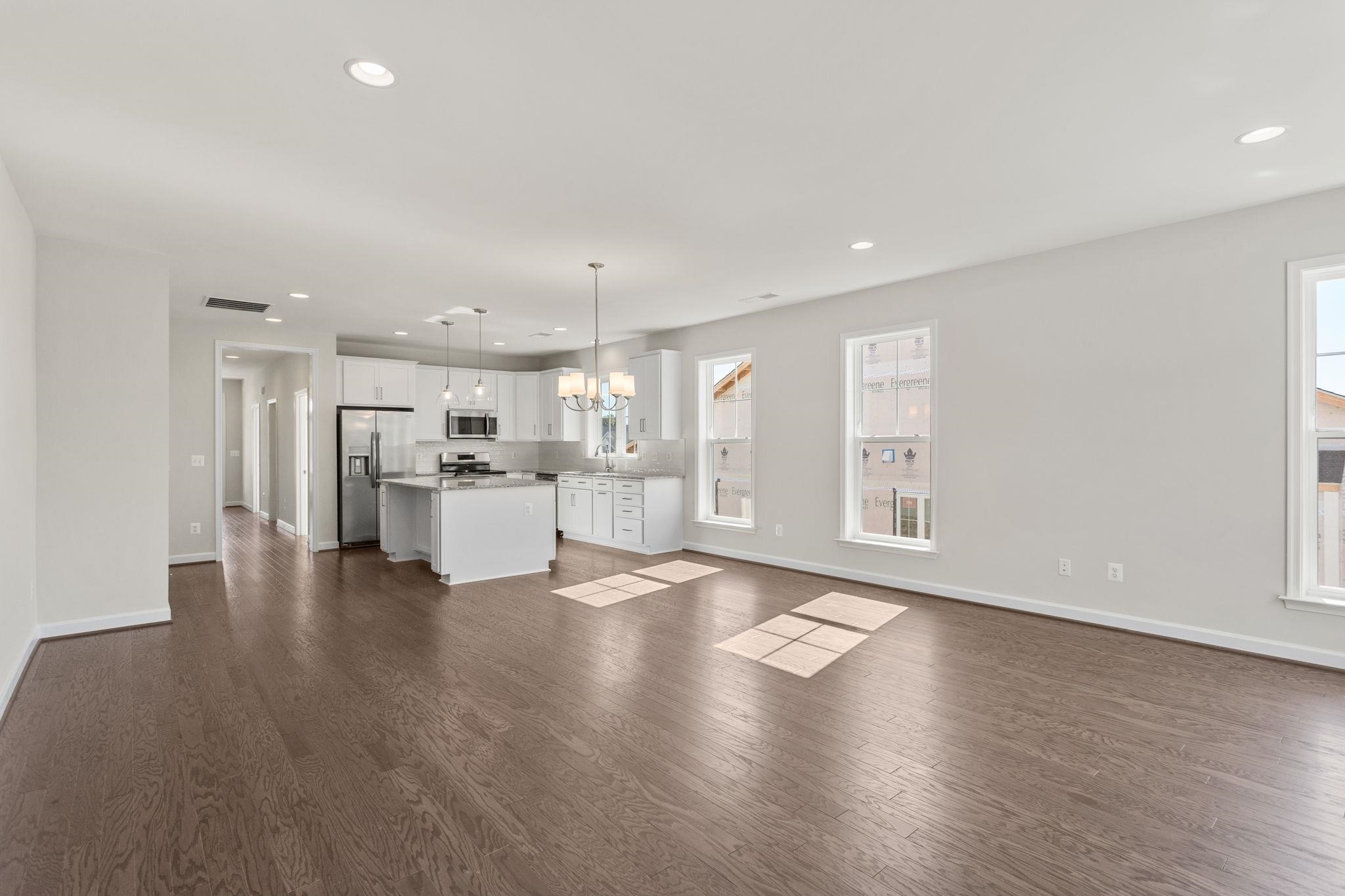 2766 Rutlege Road, Unit 191 Harrisonburg, VA 22801 - Photo 11 of 33 a view of an empty room with wooden floor and a kitchen