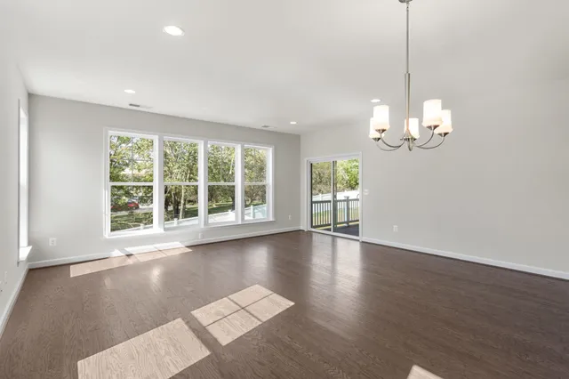 a view of a balcony with wooden floor
