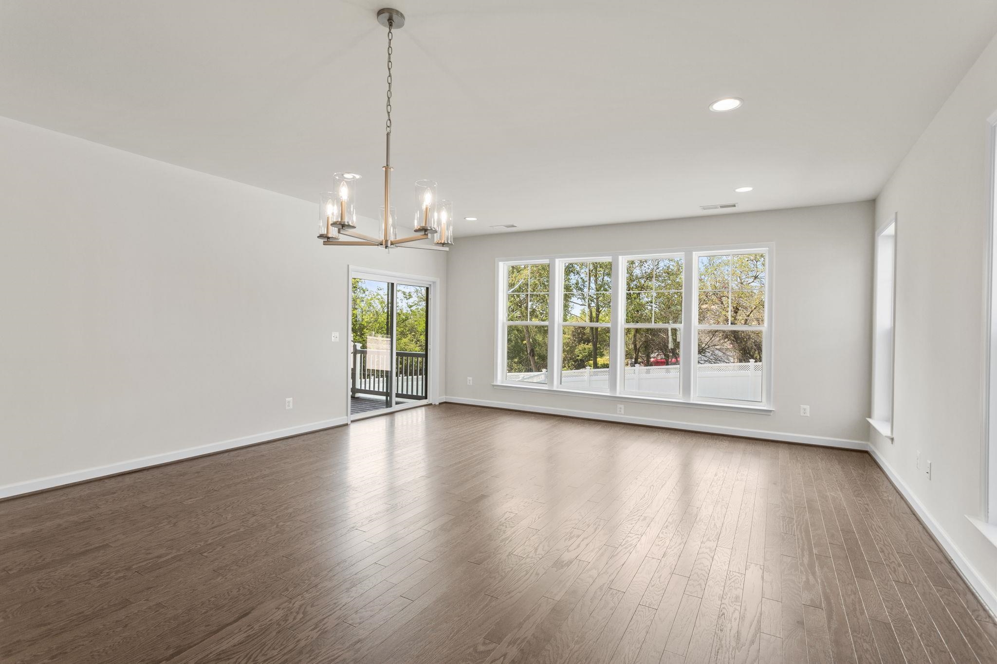 2766 Rutlege Road, Unit 191 Harrisonburg, VA 22801 - Photo 17 of 29 a view of an empty room with wooden floor and a window