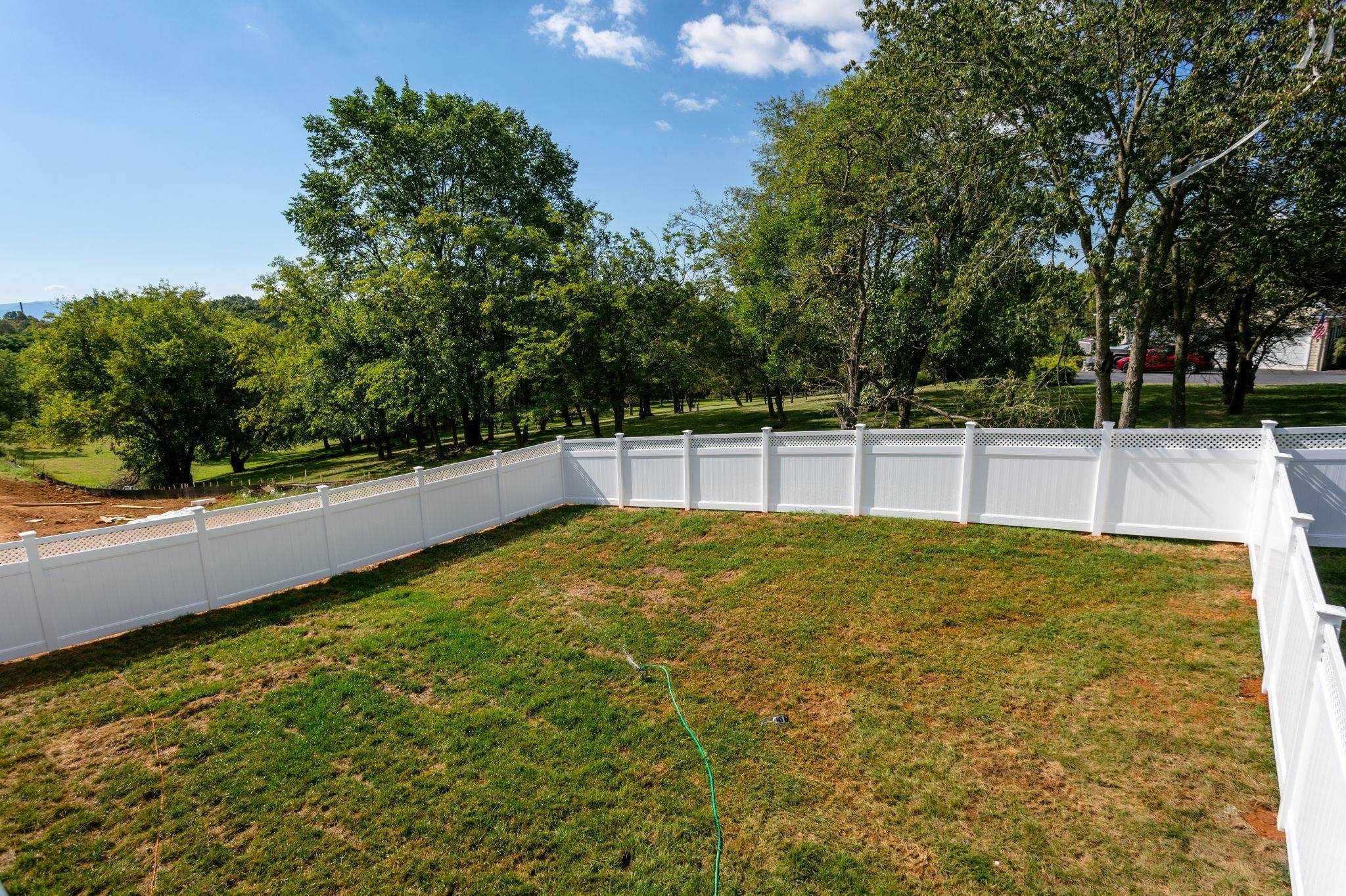 2766 Rutlege Road, Unit 191 Harrisonburg, VA 22801 - Photo 17 of 33 a view of a swimming pool with an outdoor seating and a forest